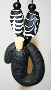 Black fimo tribal design with black and white fimo beads